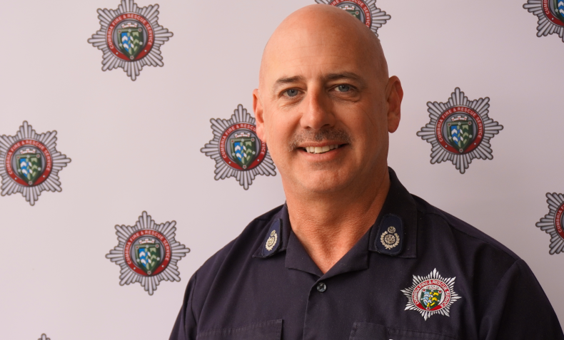 A portrait of a male firefighter