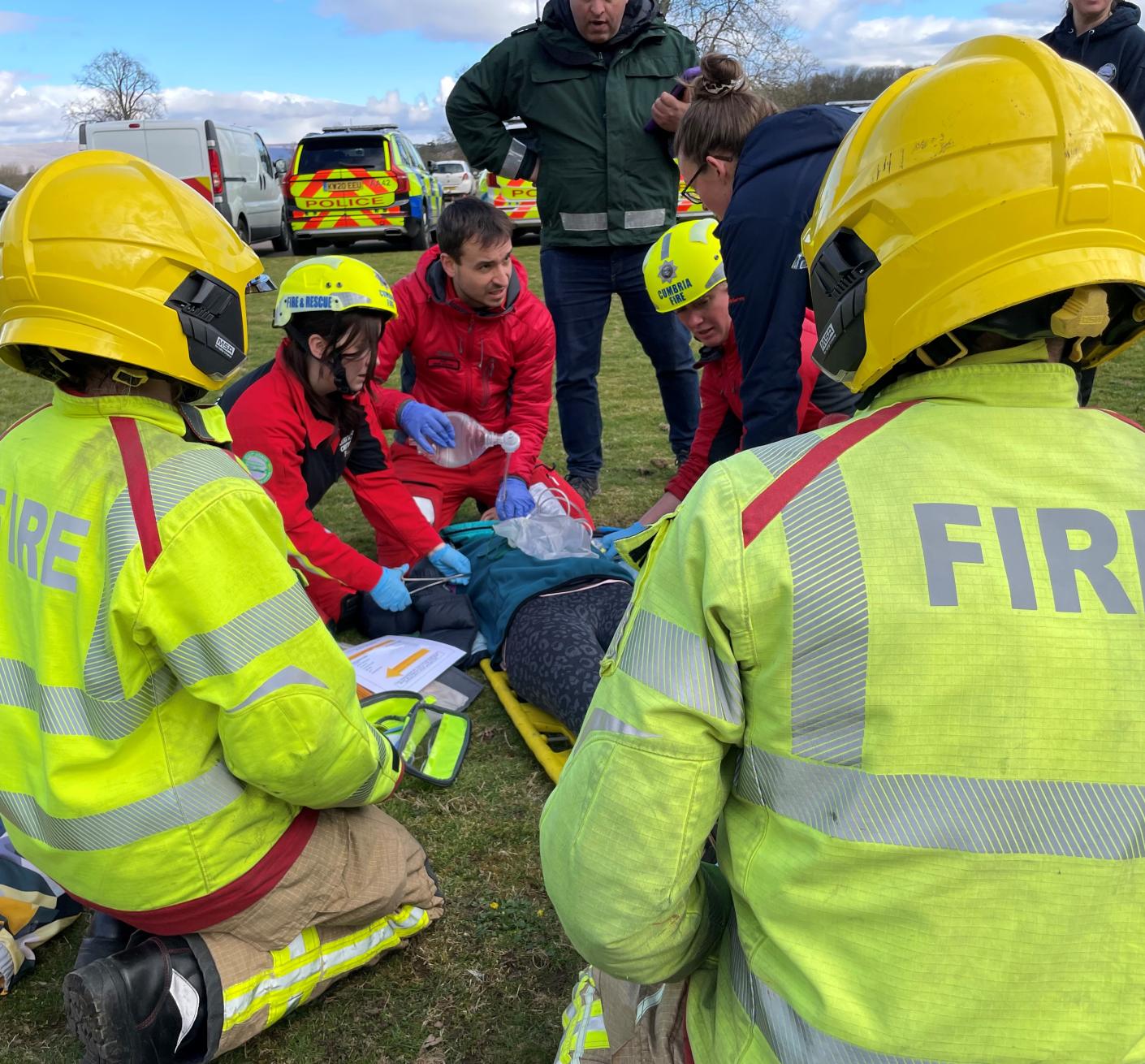 Two firefighters work with partner agencies during a training exercise