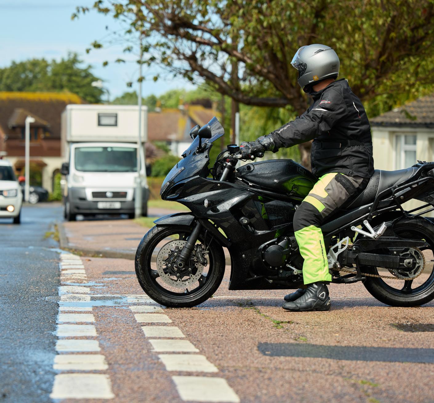 A motorcyclist at a junction waiting to pull out
