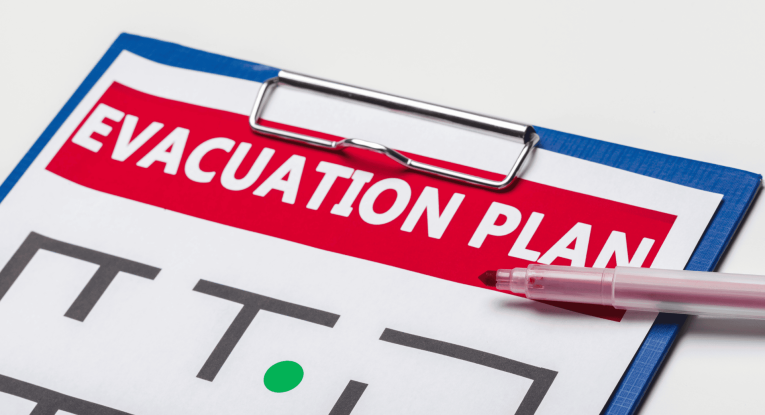An example of an evacuation plan attached to a clipboard