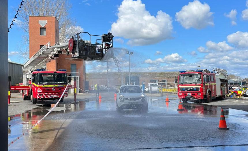 An image of the yard at Carlisle East Fire Station, with two red fire engines